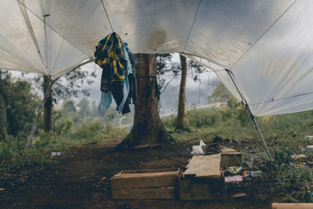 clothes hanging under white tent